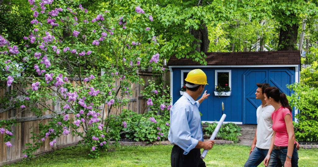 Contractor in Yard with Shed in Background