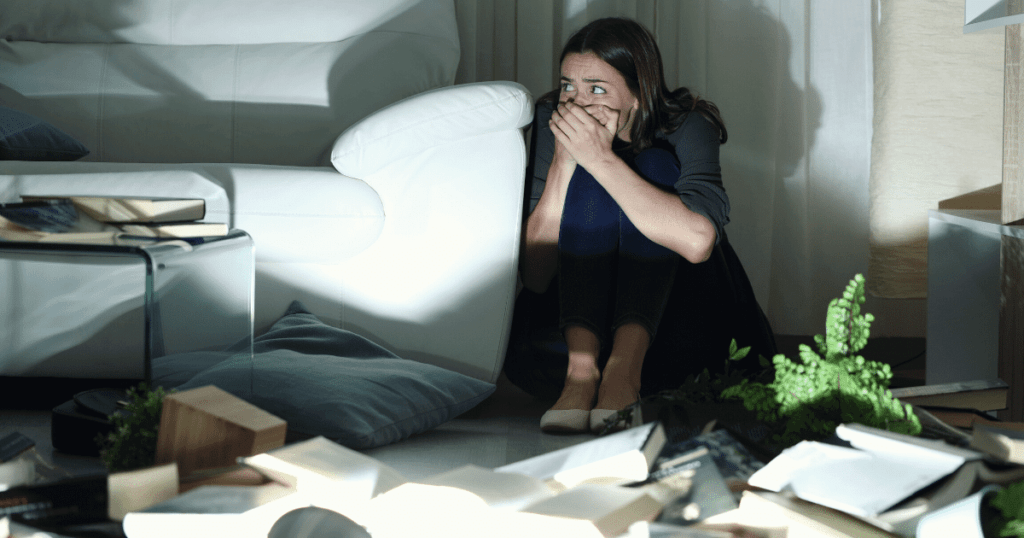 Person Hiding Behind Couch
