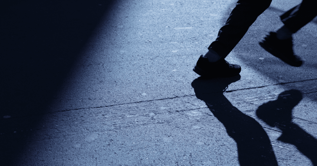 Person Running Away at Night